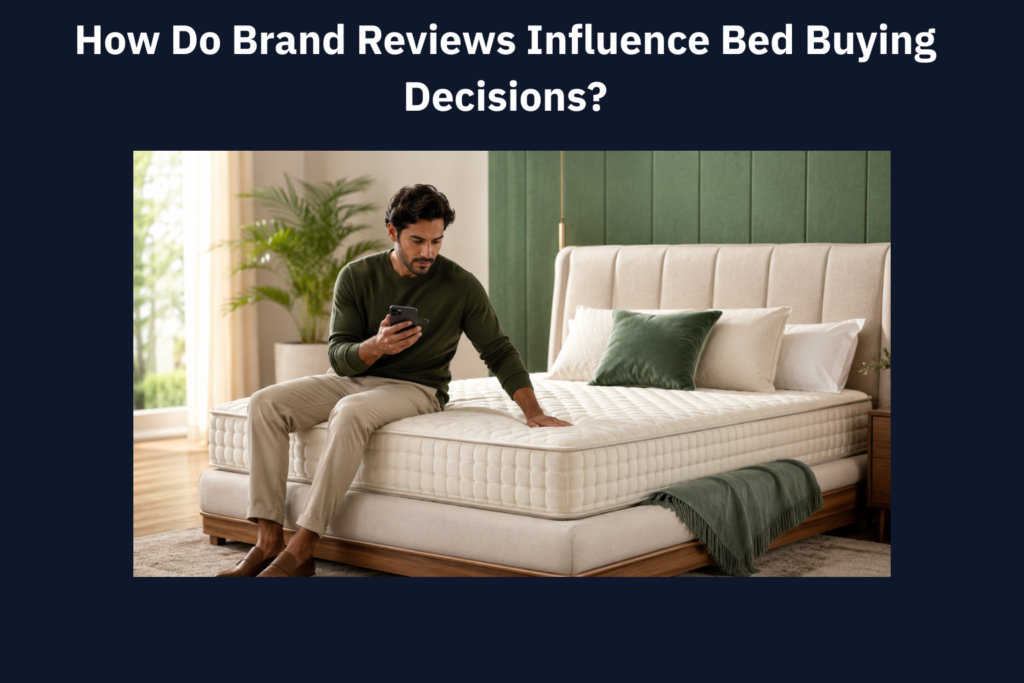 Man reading bed reviews on his phone while testing a mattress in a modern bedroom.